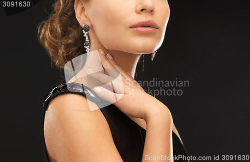 Image of woman with diamond earrings