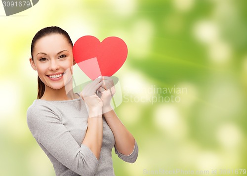 Image of smiling asian woman with red heart