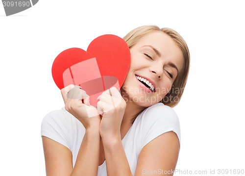 Image of smiling woman in white t-shirt with heart