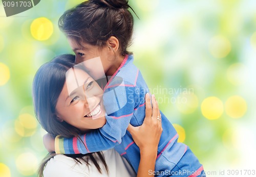 Image of happy mother and daughter hugging