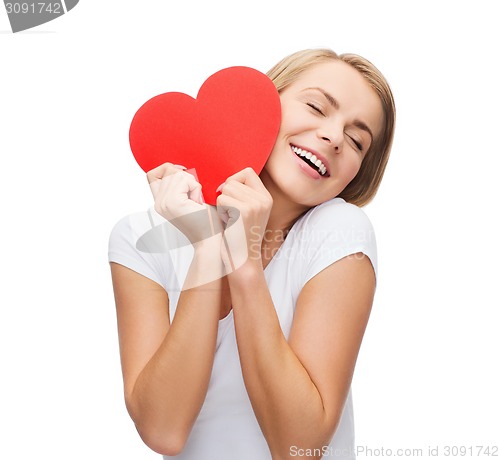 Image of smiling woman in white t-shirt with heart