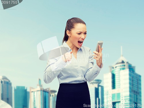 Image of screaming businesswoman with smartphone