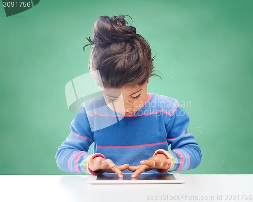 Image of little girl with tablet pc at school