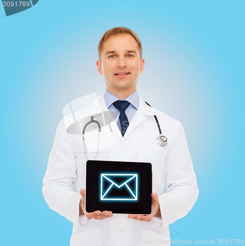 Image of smiling male doctor with stethoscope and tablet pc