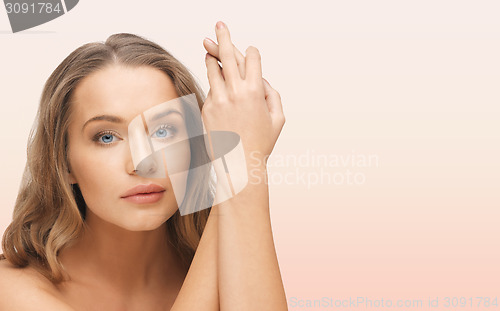 Image of beautiful woman face and hands