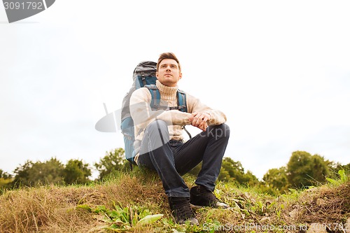 Image of man with backpack hiking