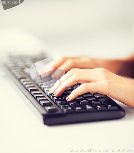 Image of woman hands typing on keyboard