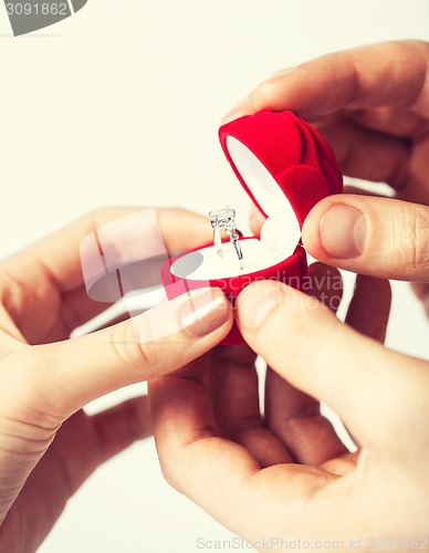 Image of couple with wedding ring and gift box