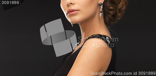 Image of woman with diamond earrings