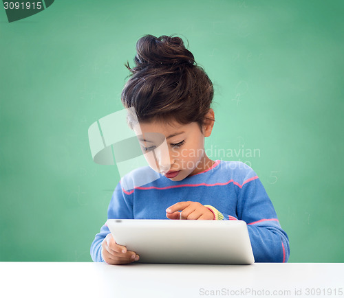 Image of little girl with tablet pc at school