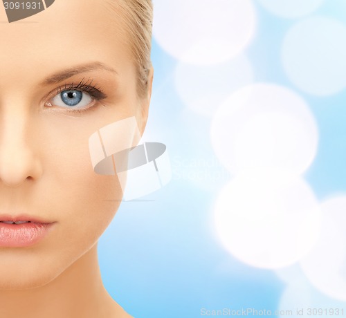 Image of beautiful young woman half face