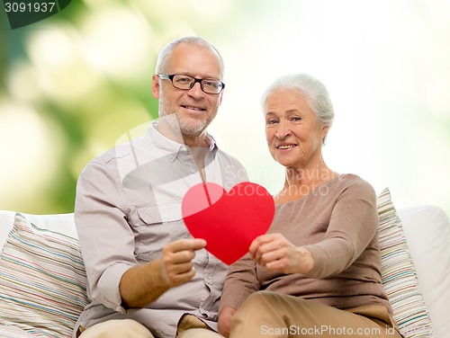 Image of happy senior couple with red heart shape