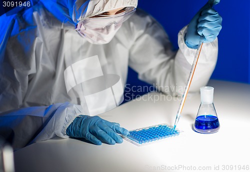 Image of close up of scientist making test in lab