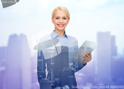 Image of smiling businesswoman with tablet pc computer