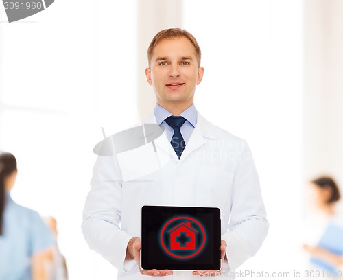 Image of smiling male doctor with tablet pc