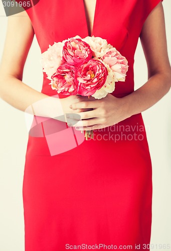 Image of woman hands with bouquet of flowers