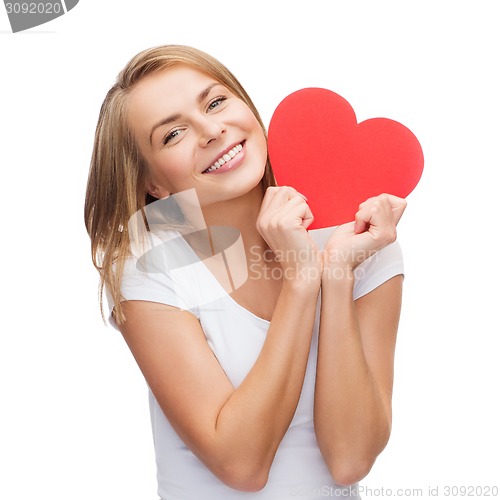 Image of smiling woman in white t-shirt with heart
