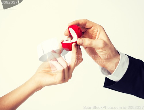 Image of couple with wedding ring and gift box