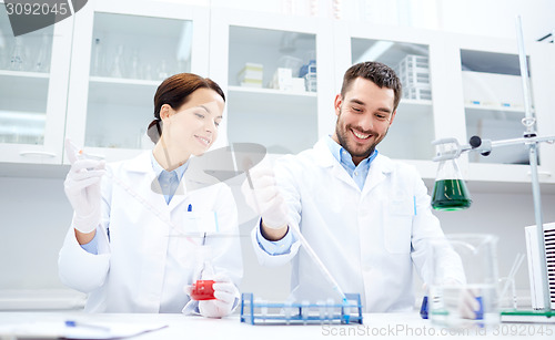 Image of young scientists making test or research in lab