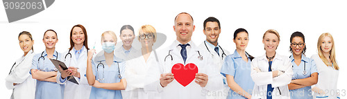 Image of group of smiling doctors with red heart shape