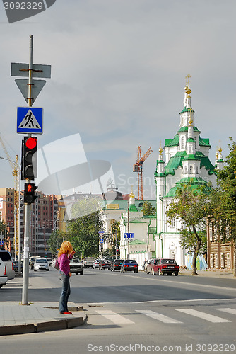 Image of Girl crosses Street against Church of the Saviour