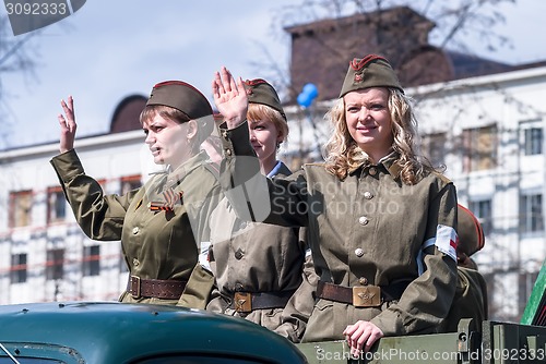 Image of Attractive girls in uniform of times WW2 on parade