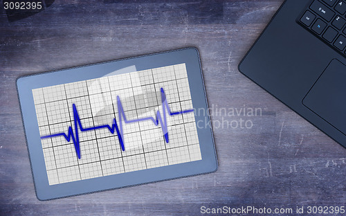Image of Electrocardiogram on a tablet - Concept of healthcare
