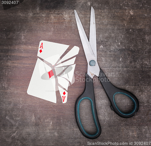 Image of Concept of addiction, card with scissors