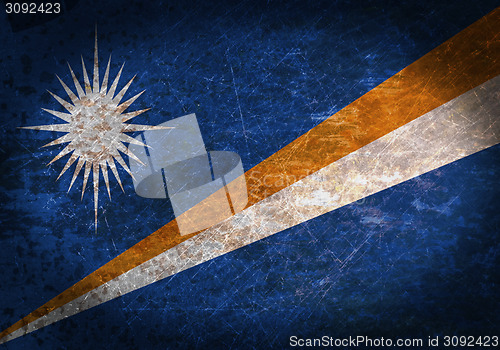 Image of Old rusty metal sign with a flag