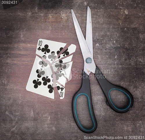 Image of Concept of addiction, card with scissors