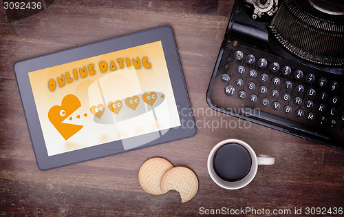 Image of Online dating on a tablet