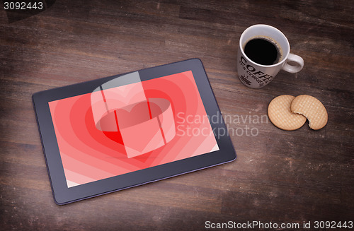 Image of Heart shape backgound on tablet