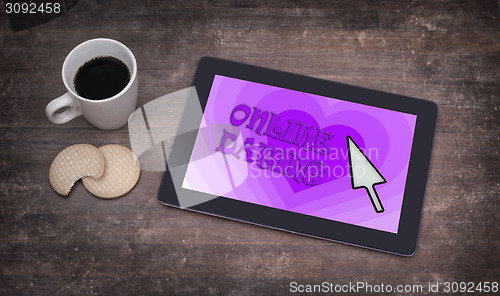 Image of Online dating on a tablet