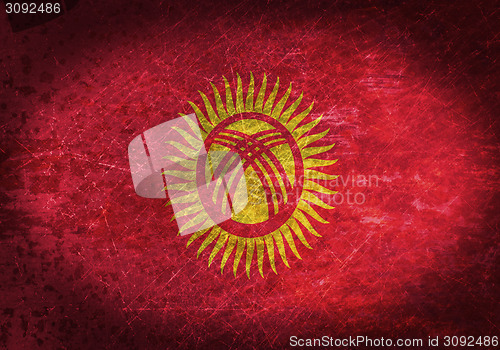 Image of Old rusty metal sign with a flag