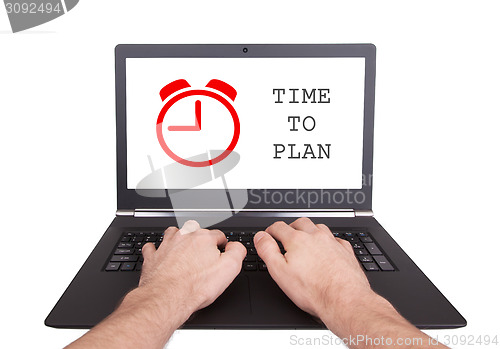 Image of Man working on laptop, time to plan