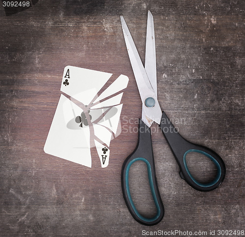 Image of Concept of addiction, card with scissors