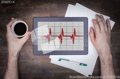 Image of Electrocardiogram on a tablet - Concept of healthcare