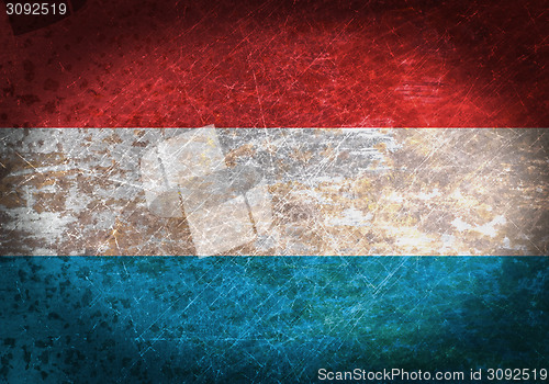 Image of Old rusty metal sign with a flag