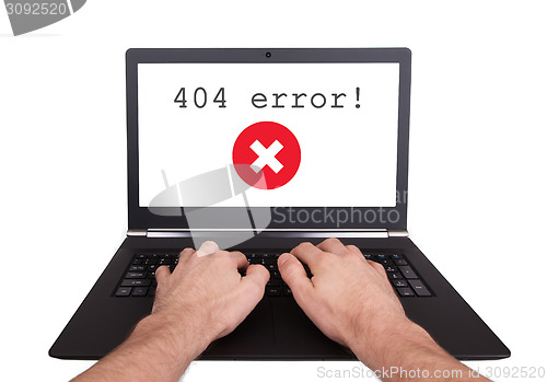 Image of Man working on laptop, 404 error
