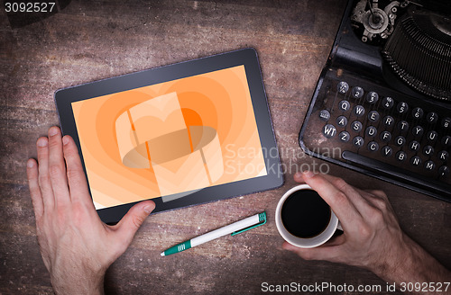 Image of Heart shape backgound on tablet