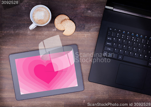 Image of Heart shape backgound on tablet