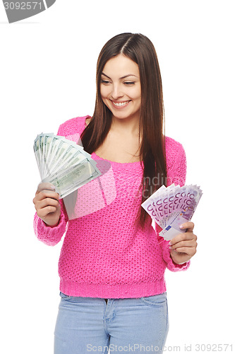 Image of Casual woman with us dollars and euro cash