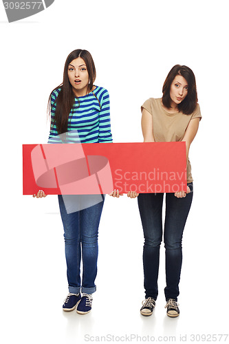 Image of Two girl friends with red banner
