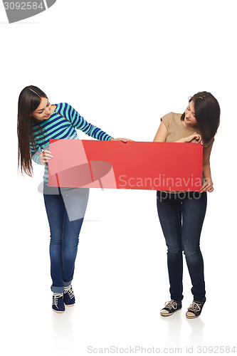 Image of Two girl friends with red banner