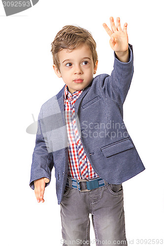 Image of little boy with with his hand lifted up