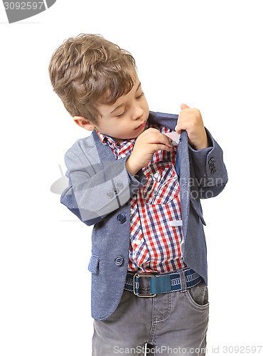 Image of little boy puts money in his pocket