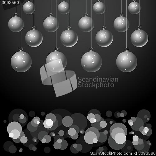 Image of silver balls on black background