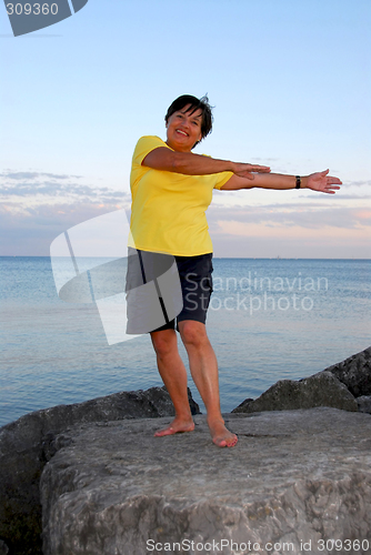 Image of Mature woman exercising
