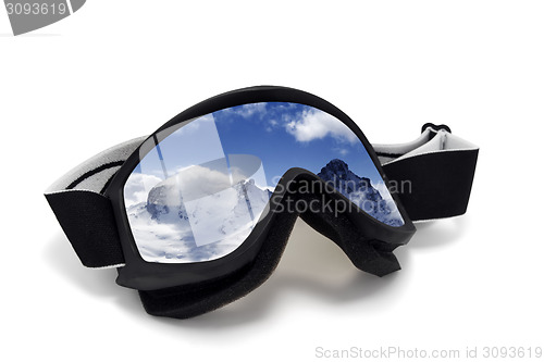 Image of Ski goggles with reflection of winter mountains