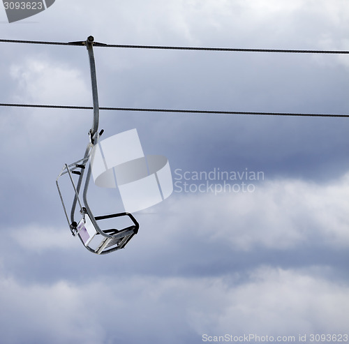 Image of Chair lift and overcast gray sky